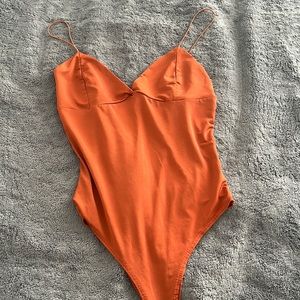 orange bodysuit